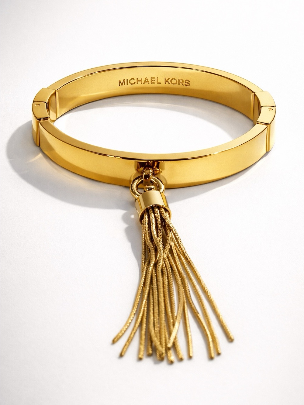 Michael Kors Gold Hinged Bangle with Tassel Charm